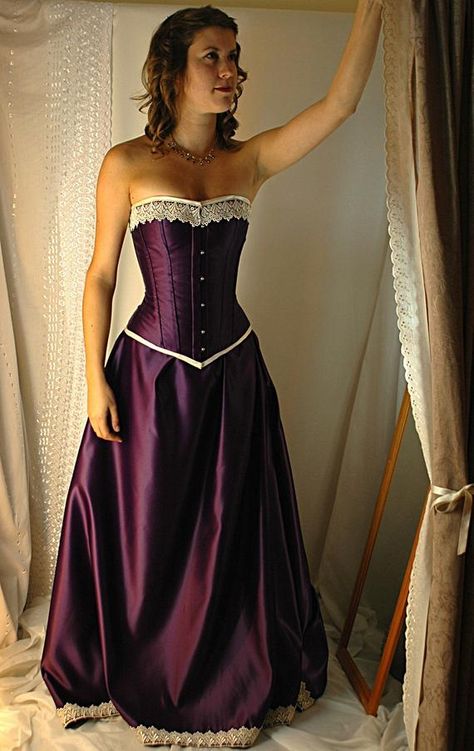 Available to see in our south coast boutique, all of our dresses are designed and made from scratch, in house in our UK studios. The Guinevere is a romantic corset gown fit for a queen, ready to take Arthurs hand. The deep and vibrant tones of the cadbury purple in a gorgeous, heavy duchess satin Tightlacing Corset, Ivory Bridal Gown, Purple Corset, Corset Gown, Black Halloween Dress, Wedding Dresses Corset, Retro Mode, Halloween Dress, Party Dresses For Women