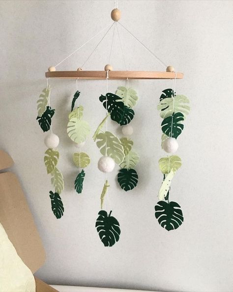 (paid link) Stunning Baby Girl Nursery Ideas You Wont Want To Miss Leaves Nursery Theme, Banana Leaf Nursery, Felt Monstera Leaf, Tiki Room Nursery, Rainforest Baby Nursery, Diy Jungle Nursery Decor, Plant Themed Baby Nursery, Plant Nursery Theme, Tropical Nursery Theme