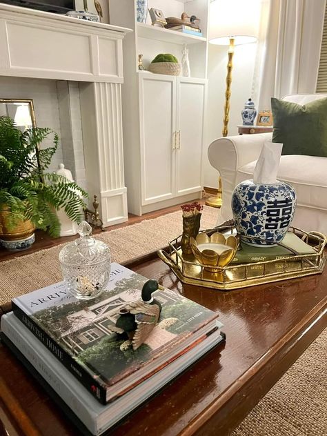 Southern Traditional Maximalist, Classy Southern Home Decor, Modern Traditional Decor Living Room Open Concept, Coffee Table Decor Traditional, Classic Southern Living Room, Regencycore Home, Nancy Meyers Wall Art, Nancy Meyers Coffee Table, Timeless Apartment Decor