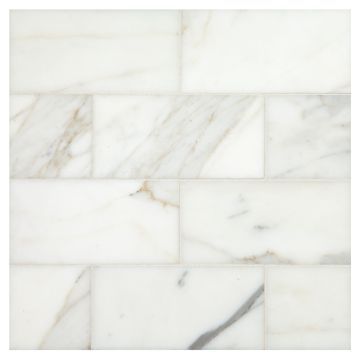 3" x 6" subway tile in honed calacatta gold marble. Natural Stone Tile Bathroom, Calacatta Tile, Stone Tile Bathroom, Marble Subway Tile, Marble Tile Backsplash, Marble Backsplash Kitchen, Luxurious Bathrooms, Calcutta Marble, Honed Marble Tiles