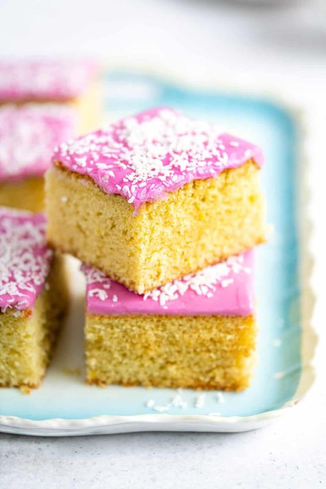 Tottenham Cake is a classic British traybake. A delicious simple sponge tray topped with pink icing and decorated with dessicated coconut or sprinkles. An incredibly simple all-in-one cake recipe that’s perfect for sharing! Tottenham Cake Recipe, Pink Cake Recipe, Tottenham Cake, Traybake Cake, Dessicated Coconut, Cake Recipes Uk, British Cake, Smooth Icing, Sandwiches Recipes