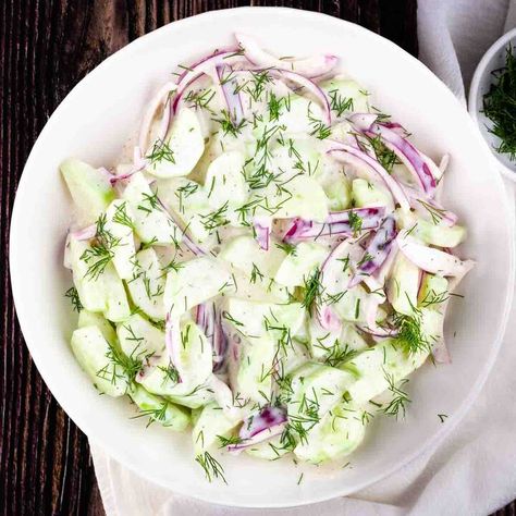 -This creamy Old-Fashioned Cucumber Salad with Mayo is the perfect side dish for any meal. With crisp, fresh cucumbers and delicious flavor from the homemade dressing, it will quickly become a family favorite! Whether you're hosting a summer BBQ or a potluck with friends and family, this easy-to-make salad is the perfect addition to any menu!   this Creamy Cucumber Salad With Mayonnaise, Cucumber Salad With Mayo, Salad With Mayonnaise, Greek Cucumber Salad, Easy Cucumber Salad, Creamy Cucumber Salad, Cucumbers And Onions, Strawberry Spinach, Creamy Cucumbers