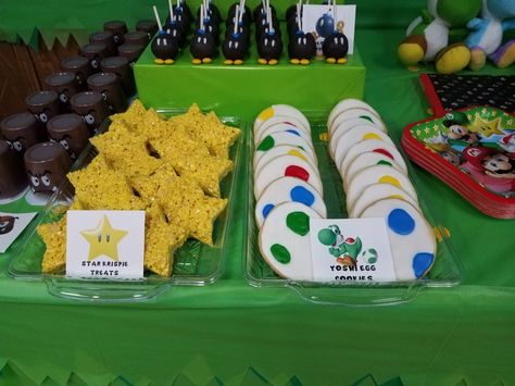 Mario Brothers themed treats:  star rice krispies, Yoshi egg cookies, Bob-omb oreo truffles Super Mario Bros Treat Ideas, Mario Star Rice Crispy Treats, Super Mario Bros Party Treats, Super Mario Themed Desserts, Diy Mario Party Food, Mario Birthday Party Dessert Table, Mario Treat Table, Yoshi Centerpieces, Mario Party Snack Ideas