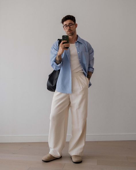 Daniel Simmons wearing a dress shirt open over a ribbed tank with some casual white pants, and some clogs or slippers Daniel Simmons, 남성 근육, Classy Streetwear, Casual Linen Pants, Classy Outfits Men, Trendy Shirt Designs, Mens Trendy Outfits, Dapper Style, Mens Casual Dress Outfits