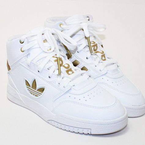 Adidas Drop Step Xl High Top White/Gold Sneakers Men's Size: U.S. 5 U.K. 5.4 Eur. 37.5 Fw2040 High Top Lace Up Cloud White/Gold Metallic 10/10 -Nwt! Excellent Condition, No Box. See Pics! Thank You. Shipping Out Daily! Adidas High Tops Mens, Adidas Drop Step, Winter Boots For Men, White And Gold Sneakers, Foam Runner, Crocs Fashion, Sneakers Jordans, Shoes Sneakers Jordans, Gold Sneakers