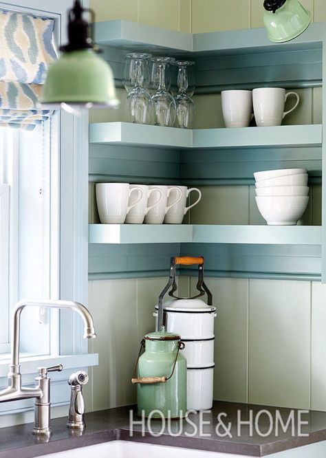 Painting the window trim, baseboards and crown molding light blue, and using a deeper blue on the cabinetry and shelves, adds dimension. “I wanted a more complex paint story,” says designer James Davie. Traditional apron-style supports and beaded edges make the open shelves look more substantial. | Photographer: Donna Griffith Cottage Bunkie, Fixer Upper Interior, Bunkie Ideas, Interior Painting Ideas, Bedroom Paintings, Teal Interiors, Colorful Cottage, Revere Pewter, Tiny Cottage