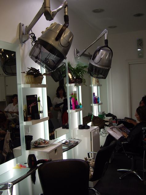 Inside salon. Rome, Italy Dryers mounted on wall at each station. Hair Washing Station Home, At Home Salon Station, Floating Salon Stations, Salon Dryer Area Ideas, Salon Hair Washing Station, Wall Mounted Hair Dryer Salons, Professional Hair Dryer Salons, Salon Shampoo Bowl With Hair Station, Salon Dryers