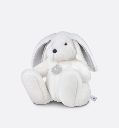 The soft, warm white faux fur rabbit toy will accompany little ones from an early age. Presented in its cotton satin pouch with the House's iconic Toile de Jouy print, the stuffed animal is an elegant and signature gift for newborns. Luxury Baby Items, Baby Dior, Bunting Bag, Newborn Accessories, Luxury Baby, Rabbit Toys, Baby Slippers, White Faux Fur, Timeless Gifts