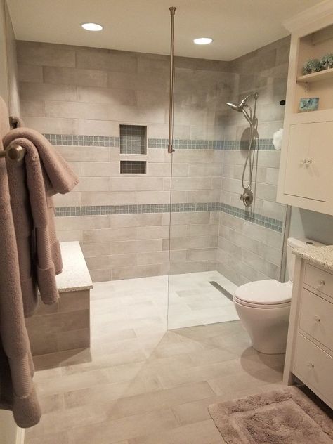 A curbless shower is just what the name says, a shower that does not have a curb or threshold. It has a seamless design with no divider. Curbless Shower With Bench, Carport Conversion, Garage Redo, Neutral Bath, Spa Baths, Tiled Bathrooms, Shower Benches, Accessible Bathroom Design, Bathroom Grey