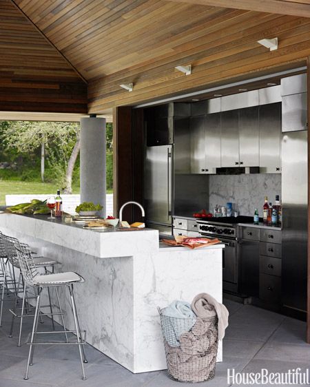 In designer Bonnie Edelman's Ridgewood, Connecticut house, the pool kitchen's stained white-oak ceiling pours warmth over cool metal custom stainless-steel cabinets. Outdoor Kitchen Countertops, Outdoor Kitchen Cabinets, Modern Outdoor Kitchen, Outdoor Kitchen Appliances, Outdoor Appliances, Basic Kitchen, Stainless Steel Cabinets, Outdoor Kitchens, Cooking Area