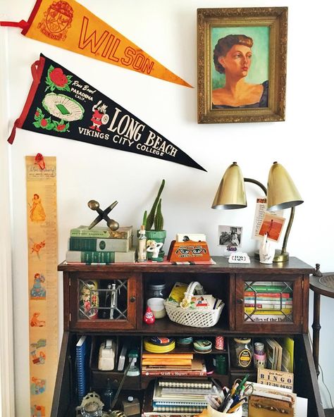 Emily Vallely on Instagram: “Be true to your school 🎤 My friend @maisonyep owner of @magnoliaandwillow managed to find vintage pennants of my high school AND college.…” Classroom Decorations High School, Pennant Display, Vintage Classroom, Hanging Pennants On Wall, College Pennant Display, Framed Pennant, College Pennants In Classroom, Vintage Pennants Display, Vintage Pennants