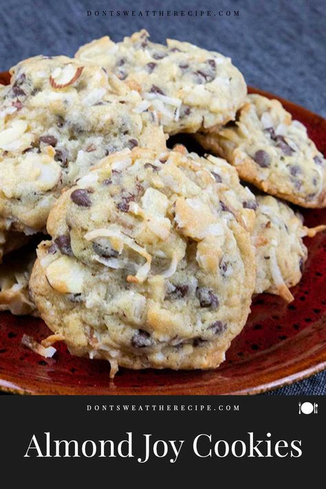 Almond Joy cookies are a blend of sweet coconut, semi-sweet chocolate chips, and sliced almonds. A delicious twist on your favorite candy bar! Almond Joy Chocolate Chip Cookies, Desserts With Sliced Almonds, Almond Joy Cookies Best, Coconut Cake Cookies, Recipes With Sliced Almonds, Desserts With Almonds, Almond Joy Cookies Recipe, Candy Bar Cookies Recipes, Recipe For Almond Joy Cookies