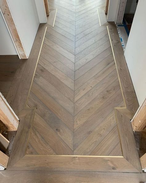 S/H Builders on Instagram: "Deep Basement; Entry Chevron Floors with metal inlays installed, crowns, beams, trim work and countertops continue Happy Friday! @nlielasus @northworks_architects" Herringbone Inlay Floor, Herringbone With Border Floor, Chevron Wood Floor Entryway, Herringbone Lvp Flooring, Chevron Entryway, Herringbone Wood Floor Foyer, Herringbone Wood Floor Foyer Entryway, Herringbone Wood Floor Entryway, Herringbone Foyer