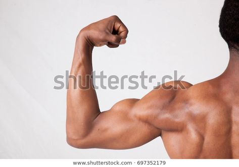 Strong Black Man Flexing His Arm Stock Photo (Edit Now) 697352179