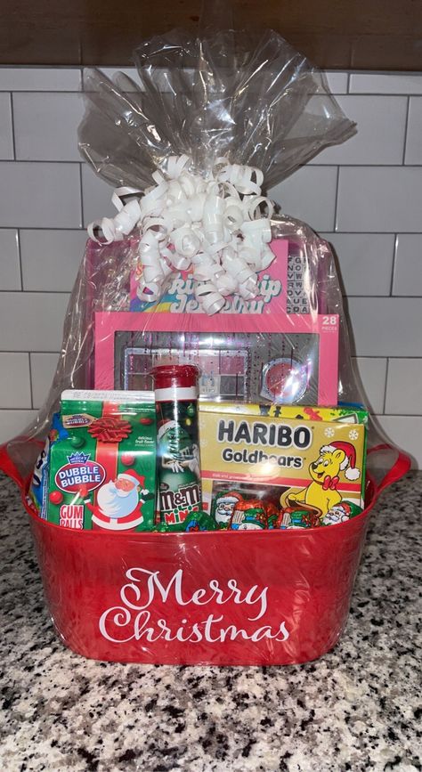 -This beautiful basket makes the perfect holiday gift. Includes toys, (for girls or boys) Christmas treats and candy. All baskets are custom-made to order so each one will vary in appearance and content but they all contain the same inspired look and quality of items. -All baskets will come wrapped tightly and topped with a bow. -If you are interested in other personalized gift baskets that are not currently listed on my page please feel free to message me. -Remember that all sales are final! Thank you for shopping!🥰 Christmas Candy Gift Baskets, Christmas Gifts For Family Members, Christmas Snack Basket, Christmas Baskets For Kids, Christmas Baskets Ideas, Kids Christmas Basket, Christmas Themed Basket, Cute Christmas Baskets, Christmas Goodies For Gifts