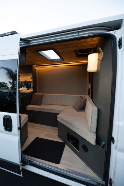 Camper Van For Sale: "Jazz" 2019 ProMaster Luxury Lounge on Wheels Van With Washing Machine, Projector In Van, Camper Vans Interiors, Van Conversion Office, Sprinter Van Interior Ideas, Camper Van Interior Ideas, Van Renovation, Sleeper Van, Van Interior Ideas