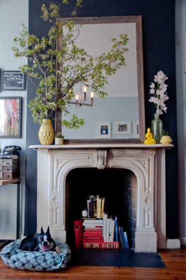 fireplace decor - large mirror, vase with flowers/branches, smaller accent items; via Sadie & Dasie from Apartment Therapy Faux Fireplace, Tiny Apartment, Mantel Decorations, Fireplace Mantle, Mantle Decor, A Living Room, Fireplace Decor, Fireplace Mantels, A Fire