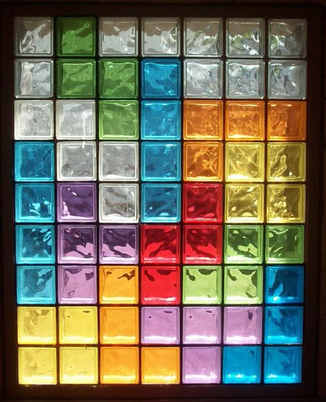 I did stained glass on our front door, but this is just sheets of cellophane which would be easier and less permanent. Colored Glass Bricks, Stained Glass Blocks, Coloured Glass Bricks, Color Glass Wall, Glass Bricks Ideas, Coloured Glass Window, Glass Brick Wall, Brick Window, Glass Blocks Wall