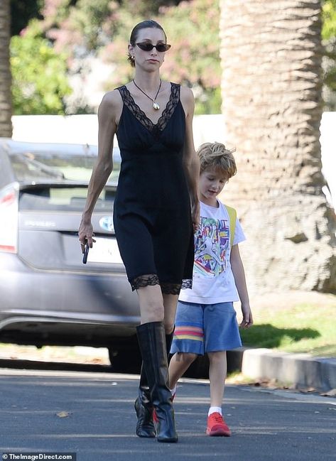 Whitney Port is the epitome of elegance in a black slip dress and knee-high boots while out with her son Sonny, six, in Los Angeles | Daily Mail Online Whitney Port, Dresses With Cowboy Boots, Black Slip Dress, Celebrity Street Style, Black Slip Ons, Daily Mail, High Boots, Knee High Boots, Cowboy Boots