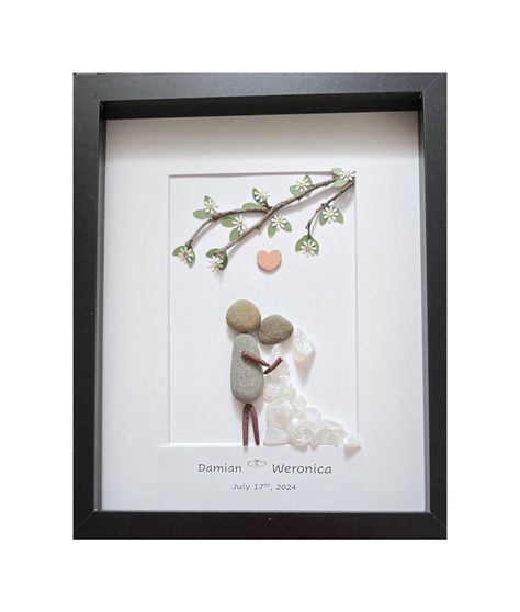 One of-kind Bride and Groom Personalized Pebble Art, Rocks Wedding Anniversary gift, with a tree branch and handmade leaves and white flowers ❤️ Bride and Groom Personalized Wedding Art in 9x11frame with tree Braches and flowers, Rock Art Wedding, Pebble Art Wedding Gift, WHITE or BLACK Frame available 🌳This Unique Couple portrait is made in approximately 9x11 frame size, and it's protected by glass  🌳Excellent present for outdoors and nature loving couple or family as an: Engagement Gift Wedd Pebble Art Wedding Couple, Wedding Rock Art, Wedding Pebble Art, Rock Family Art, Pebble Art Wedding, Stone Pictures Pebble Art, Art Wedding Gift, Rock Family, Flowers Bride