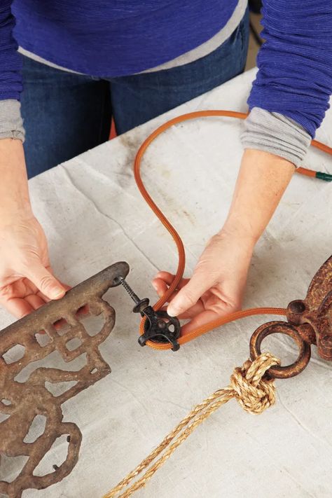 How to Use a Barn Pulley to Make a Wall-Mount Light Fixture - This Old House Pulley Light Fixture, Mobile Boutiques, Pulley Decor, Rustic Light Fixture, Hay Trolley, Pulley Light, Industrial Lights, Whiskey Bottles, Barn Houses