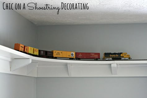 DIY HO Train track shelf around room ceiling by Chic on a Shoestring Decorating Track Shelf, Train Bedroom, Train Room, Budget Friendly Decor, Room Ceiling, Rooms Reveal, Toy Rooms, Boy Bedroom, Big Boy Room