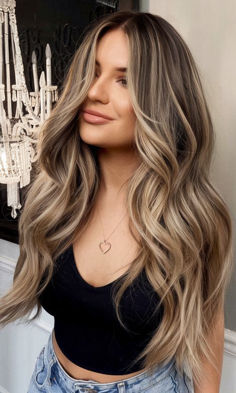 Elevate your hair game this autumn with 10 Gorgeous Fall Bronde Balayage Ideas for a Trendy Look! Blending the warmth of brunette with the brightness of blonde, these bronde balayage styles are perfect for adding dimension and depth to your fall hairstyle. Whether you prefer soft and subtle or bold and vibrant, these bronde hues will keep you looking chic all season long. 🍁💇‍♀️ #FallHair #BrondeBalayage #HairColorTrends #Balayage #HairInspo #FallBeauty #TrendyHair #BrondeHair Light Beige Balayage, Glazed Donut Hair, Cool Beige Blonde Hair Highlights, Creamy Beige Balayage, Long Blonde Hair Dark Roots, Beige Blonde Balayage Dark Roots, Soft Summer Brunette, Blonde Hair Color Ideas Fall 2024, Hair Ideas For Pale Skin