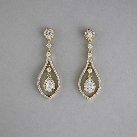 Glistening teardrop-shaped CZ earrings, crafted in layers of timeless beauty, will add a touch of subtle elegance to your bridal look. These earrings are rhodium or gold plated, hypoallergenic, lead, nickel, and cadmium free, and made with AAA CZ stones. They measure about 2 inches long and 5/8 inches wide and have post pierced backs. Teardrop Bridal Earrings, Fav Products, Teardrop Jewelry, Weaving Ideas, Gold Earrings Wedding, Wedding Day Jewelry, Eye Makeup Designs, Pinterest Ideas, Subtle Elegance