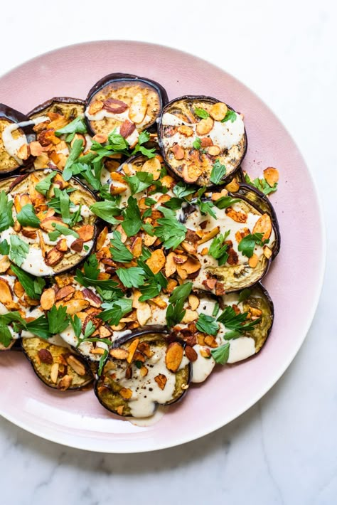 Easy Ottolenghi-Inspired Roasted Eggplant with Tahini Sauce, Spiced Almonds and Parsley | The New Baguette #eggplantrecipes #veganrecipes #tahini #eggplant #ottolenghi #middleeasternrecipe Fingerling Eggplant Recipes, How To Roast Eggplant, Eggplant With Tahini Sauce, Baguette Recipes, Zone Recipes, Spiced Almonds, Ottolenghi Recipes, Paleo Sides, Starch Solution