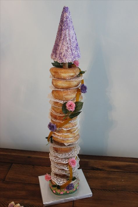 Donut tower Rapunzel Donut Tower, Tangled Backdrop, Summer Party Cake, Rapunzel Birthday Cake, Aaliyah Birthday, Donut Tower, Mimi Birthday, Tangled Birthday Party, Rapunzel Birthday