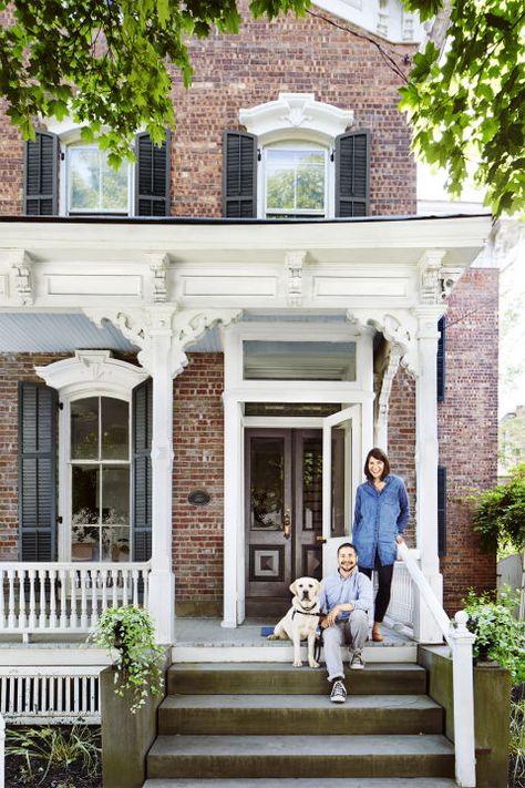 When Theresa and Michael Drapkin relocated to Kingston, New York, in 2013 to open Kingston Wine Co., they took their time house hunting. And things didn't start out all that promising on the summer day when they agreed to meet their real estate agent at a home in a historic waterfront neighborhood. Although the couple immediately liked the exterior of the 1850s property—floor-to-ceiling shutters, a backyard space unique to the area—their agent cautioned them to keep an open mind before they e... Mediterranean Farmhouse Exterior, Rustic Mediterranean Farmhouse, Contemporary Farmhouse Exterior, 1800s Home, Victorian Porch, Rustic Mediterranean, Farmhouse Exterior Design, Black Shutters, Front Steps