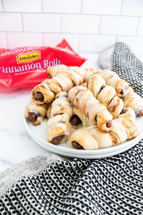 Cinnamon Roll Pigs in a Blanket are a delicious way to start your day. We're using Rhodes cinnamon rolls and breakfast sausage links to make these fun bites.