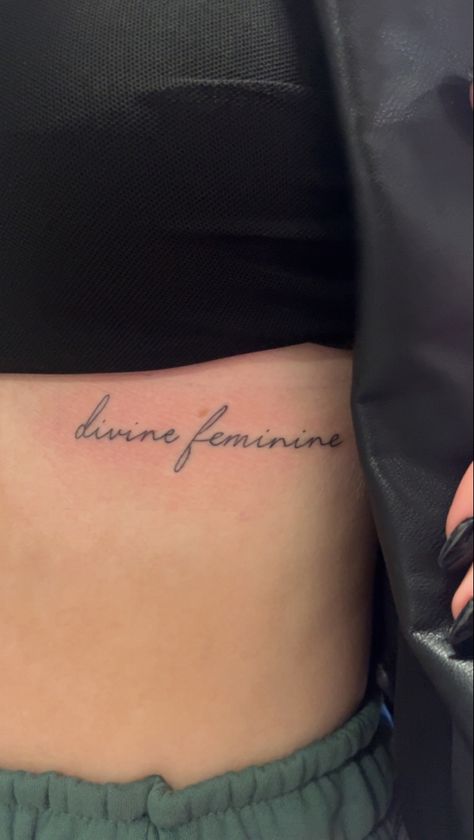 tattoo idea Women Tattoos Underboob, Devine Femine Tattoo, Devine Feminine Tattoos For Women, Devine Feminine Tattoo Ideas, Divine Feminine Tattoo Cursive, Feminine Word Tattoos, Define Feminine Tattoo, Divine Tattoo Ideas, Underboob Word Tattoo