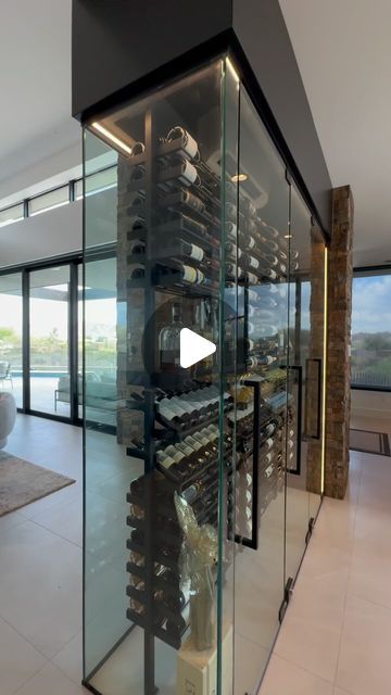 Living Room Wine Cellar, Temperature Controlled Wine Room, Double Sided Glass Wine Wall, Wine Cellar Glass Wall, Wine Wall Ideas Dining Rooms, Glass Wine Cellar Under Stairs, Glass Wine Cellar Wall, Diy Wine Room, Wine Rooms In House