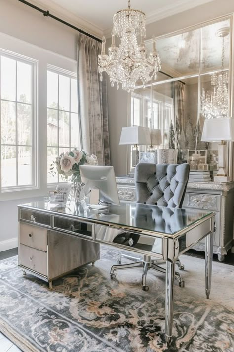 A glam chic home office with a mirrored desk, plush velvet chair, and crystal chandelier exudes luxury. The reflective surfaces and opulent materials create a glamorous and elegant environment. Mirrored Desk Office, Boss Lady Home Office Ideas, Glam Office Decor Workspaces, Glam Library, Luxury Living Room Designs Modern Interiors, Girly Home Office Ideas, Glamorous Office, Luxury Office Design, Mirrored Desk