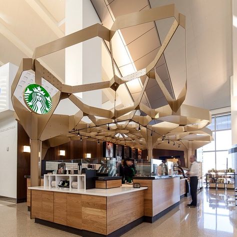 This location celebrates the craft of coffee making. Designer Jon Wagner and fellow designer Jennifer Porteous drew inspiration from the pattern of foamy milk at the top of a latte. #WhereInTheWorld #Padgram Starbucks Interior, Coffee Shop Lighting, Cafe Idea, Café Starbucks, Starbucks Design, Los Angeles Airport, Starbucks Store, Coffee In Bed, Warehouse Conversion