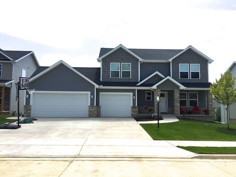 Mastic Deep granite gray siding with grey hand split shake and white trim with a Black roof in Edwards IL Grey Siding Black Trim, Mastic Vinyl Siding, Black Gutters, Mastic Siding, Gray Siding, Grey Siding, Black Roof, Garage Addition, Wood Roof