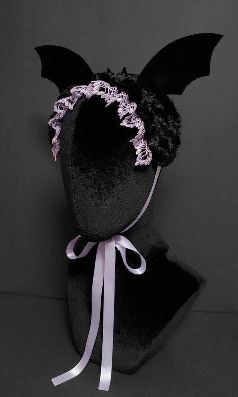 This is a creepy cute bat bonnet designed and handmade by me. It is made of an extremely soft swirl fur base with hand sewn velvet covered interface bat wings and velvet ears. The bonnet is embellished with a scalloped venice lace and braid trim on the underside base. The piece fastens with a matching double face satin ribbon that ties into a bow beneath the chin. Bat Ear Headband, Lace Designs, Bat Cute, Face Accessories, Cute Bow, Creepy Cute Outfits, Creepy Cute Fashion, Piskel Art, Instruções Origami