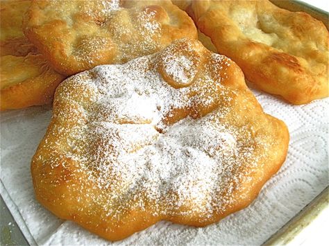 Fried dough. Two simple, straightforward words. Fried. Dough. Yet what a wonderful metamorphosis takes place when a simple flour/butter/water dough hits a scant 1/2″ of hot oil. POP goes the dough, coming suddenly to life as air, trapped inside, expands to create big bubbles. And what was formerly a soft, pale round of dough becomes … Carnival Fried Dough, Deep Fried Bread Dough, Homemade Fried Dough, Fry Dough Recipe, Dough Boys Recipe, Fried Dough Recipe Easy, What To Make With Flour, Gluten Free Fry Bread, Fried Dough Recipe