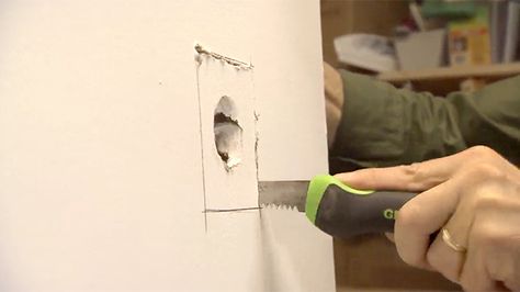 Here's a tip for patching a hole in drywall:  Start by using a drywall saw to cut a square around the hole.  Get an extra piece of drywall and cut a patch 2 inches larger than the hole on all sides.  Turn the patch over and score four lines, snap it, and peel off the gypsum core. What you're left with is a square of drywall attached to the center of the paper.  Spread some drywall joint compound on the back of the paper and plug it in the square you cut out of the wall.  Smooth out the paper ... Fixing Drywall Holes, Hole In Wall Repair, Patching Holes In Walls, Fix Hole In Wall, Repair Drywall Hole, Fixing Drywall, Orange Peel Walls, Homeowner Tips, How To Patch Drywall