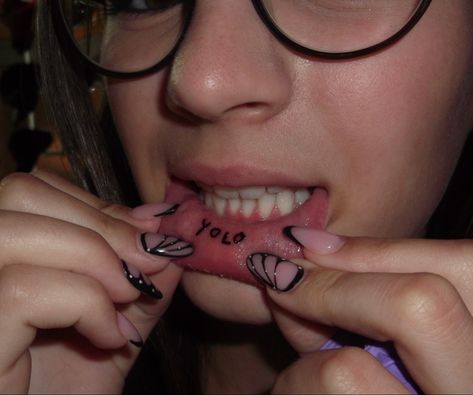 lip tattoo, lips, tattoo, yolo, nails, black french nails, butterfly nails, black butterfly nails Underlip Tattoo, Under Lip Tattoo, Butterfly Nails Black, Yolo Lip Tattoo, Yolo Tattoos, Lip Tats, Black Butterfly Nails, Lip Tattoo Ideas, Inside Lip Tattoos