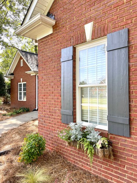 Shutters Brick House, Iron Window Boxes, Outdoor Window Shutters, Black Paint Colors, Window Baskets, Exterior Vinyl Shutters, Exterior Home Colors, Farmhouse Shutters, Outdoor Shutters