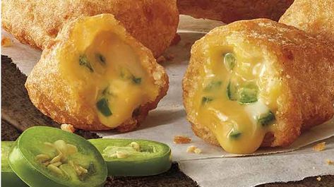 Burger King bolsters their sides menu with the introduction of new Jalapeño Cheddar Bites at participating locations.  Jalapeño Cheddar Bites feature cheddar cheese and bits of Jalapeño coated in a crispy-fried breading. They’re served with a side of Ranch sauce for dipping.  It’s my understanding that Jalapeño Cheddar Bites will be available at participating locations as part of a soft launch in advance of their official nationwide debut on April 3, 2020. I would suggest calling ahead Jalapeno Cheddar Bites, Burger King Fries, Chilli Bites, Jalapeno Appetizer, Jalapeno Bites, Fried Jalapenos, Jalapeno Cheddar Cornbread, Jalapeno Popper Recipes, Cheesy Snack