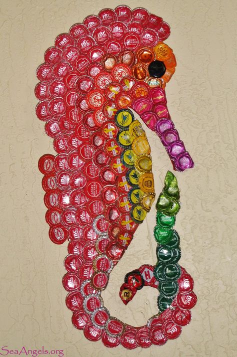 This seahorse was made from metal caps that were found littered on the beach. It may look pretty hanging on wall but not so pretty when littered in nature. Beer Cap Projects, Bottle Top Art, Beer Bottle Cap Crafts, Diy Bottle Cap Crafts, Beer Cap Art, Bottle Top Crafts, Bottle Cap Projects, Diy Beer, Aluminum Can Crafts