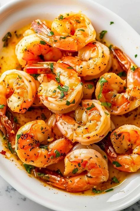 This recipe for garlic butter shrimp is quick, easy, and so satisfying! With a lemon-based, garlic-infused broth, you won't be able to get enough. Food Ideas With Shrimp, Buttered Shrimp, Shrimp Appetizer Recipes, Cooked Shrimp Recipes, Buttered Shrimp Recipe, Creamy Shrimp Pasta, Butter Shrimp, Garlic Butter Shrimp, Chicken And Shrimp