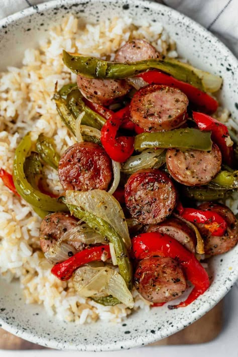 Quick and east sheet pan sausage and peppers are gluten-free and dairy-free. Don't love peppers? This healthy, low-carb, protein-packed meal made with sausage and onions can be served with rice or potatoes, or on its own! Easy Meals Family Of 4, Easy Dinner With Peppers, Easy Meal For 8 People, Simple Healthy Dinner Ideas Clean Eating, Healthy Husband Approved Meals, Sausage And Pepper Rice Bowl, Easy Pan Dinners, Quick Healthy Dinner Recipes For Two, Healthy Polish Sausage Recipes