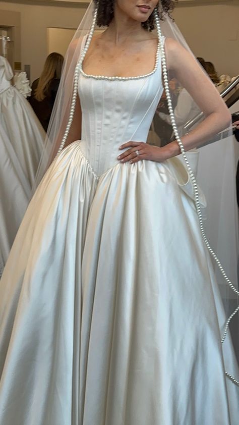 Square neck satin gown with drop waist and pearl lining (Designer: Pnina Tornai) Imperial Waist Wedding Dress, Pearl Colored Wedding Dress, Square Neck Dress Aesthetic, Imperial Wedding Dress, Designer Vintage Wedding Dress, Dress Waist Styles, Chanel Inspired Wedding Dress, Low Drop Waist Wedding Dress, Princess Waist Wedding Dress