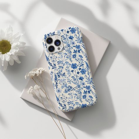 Enhance your phone with the elegant Toile De Jou Floral Slim Blue Aesthetic cover - the perfect gift for her. This unique flower phone case combines style and protection, making it a must-have accessory for any fashion-forward individual. ABOUT THE PHONE CASE  -Material: TPU (Thermoplastic Polyurethane)  -Slim form and lightweight design - Slimline and low profile, fitting tightly - Precise cutouts for connectivity - Supports wireless charging - Semi-transparent, matte finish RETURN POLICY We wa Preppy Phone Case, Phone Case Floral, Aesthetic Cover, Phone Gift, Blue Phone Case, Pretty Phone Cases, Floral Phone Case, Flower Phone Case, Unique Flowers