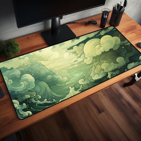 Are you looking for a desk mat that combines cottage core and anime aesthetics? You will love this cottagecore desk mat, a green desk mat that features a whimsical design of turbulent waves and clouds. This desk mat is perfect for adding some charm and personality to your desk, whether you use it for work, study, or gaming. This desk mat is made of high-quality neoprene material, which is durable, smooth, and comfortable. The desk mat has a non-slip rubber base, which prevents it from sliding or moving on your desk. The desk mat also has a stitched edge, which prevents it from fraying or peeling. This desk mat comes with 3 sizes. It can fit your keyboard, mouse, laptop, and other desk accessories. You can also use it as a mouse pad, a writing pad, or a drawing pad. The desk mat is easy to Green Gamer Aesthetic, Cute Mousepad, Anime Elements, Clouds Cute, Green Desk Mat, Cottagecore Desk, Japanese Desk, Mat Aesthetic, Anime Magic