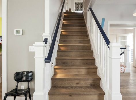 Gray Staircase, White Banister, Banister Remodel, Top Of Stairs, Cool House, Oak Trim, Wooden Steps, Wooden Stairs, Blue Accents